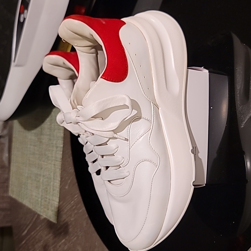Steve McQueen platform tennis shoes white leather with red saude back.